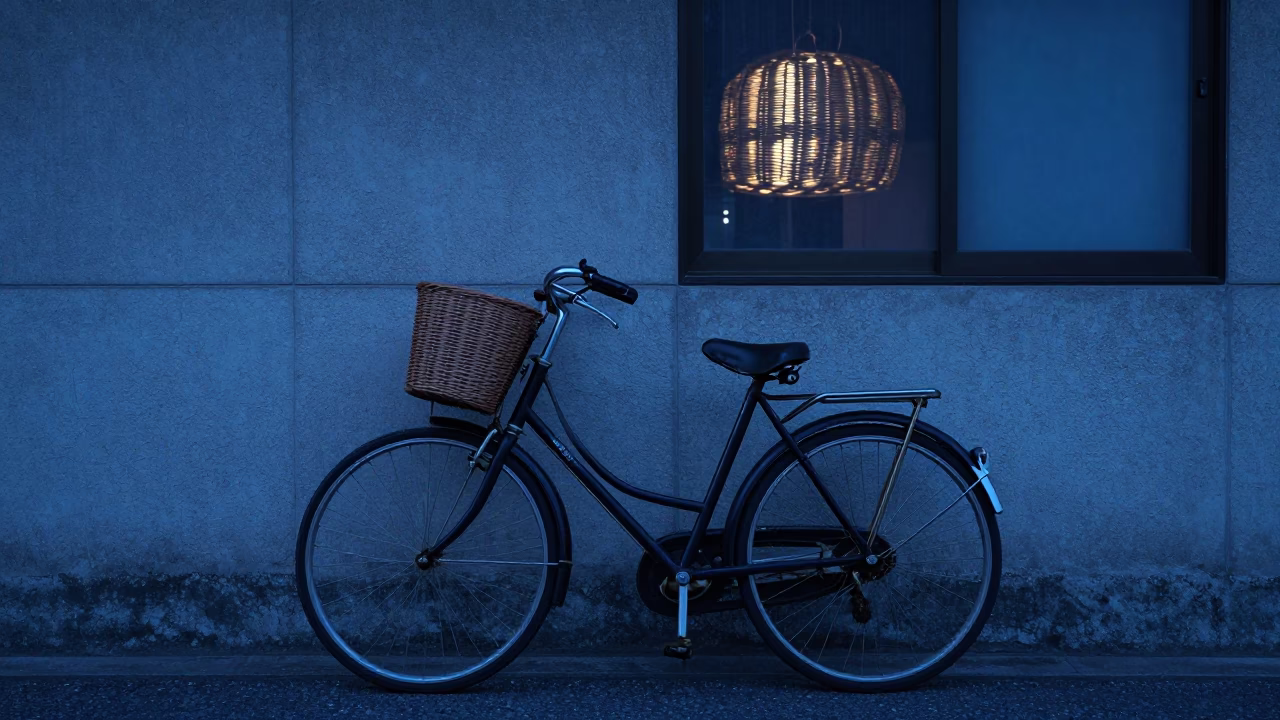 Vintage Bicycle Leaning Against Wall in Osaka Evening Blue Light in in Osaka, Japan