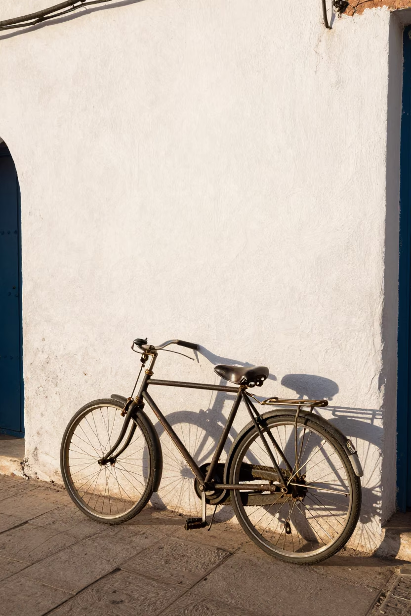 Vintage Bicycle Leaning Against White Stucco Wall in Casablanca Morocco Late Afternoon in in Casablanca, Morocco