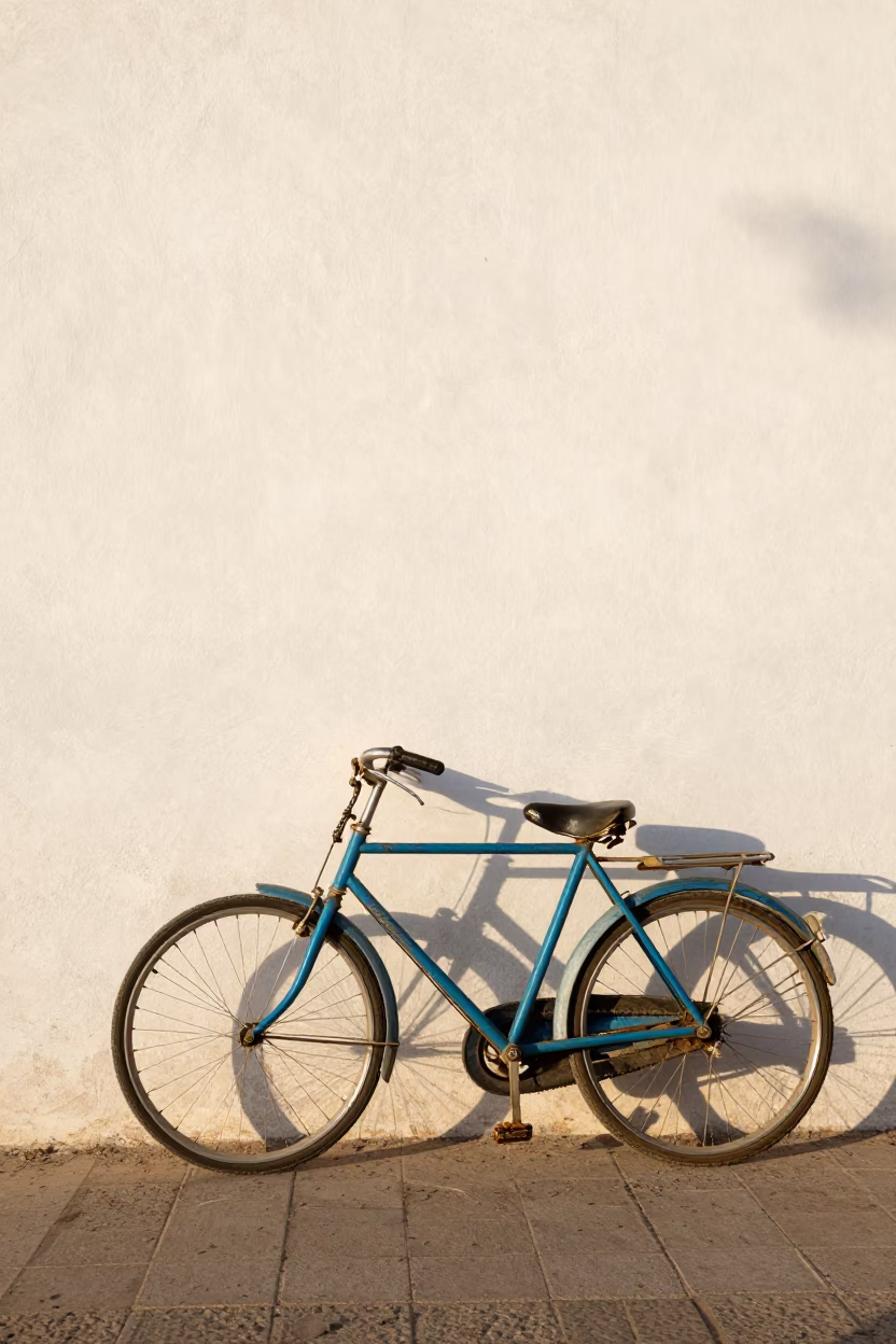Vintage Bicycle Leaning Against White Wall in Casablanca Late Afternoon Light in in Casablanca, Morocco