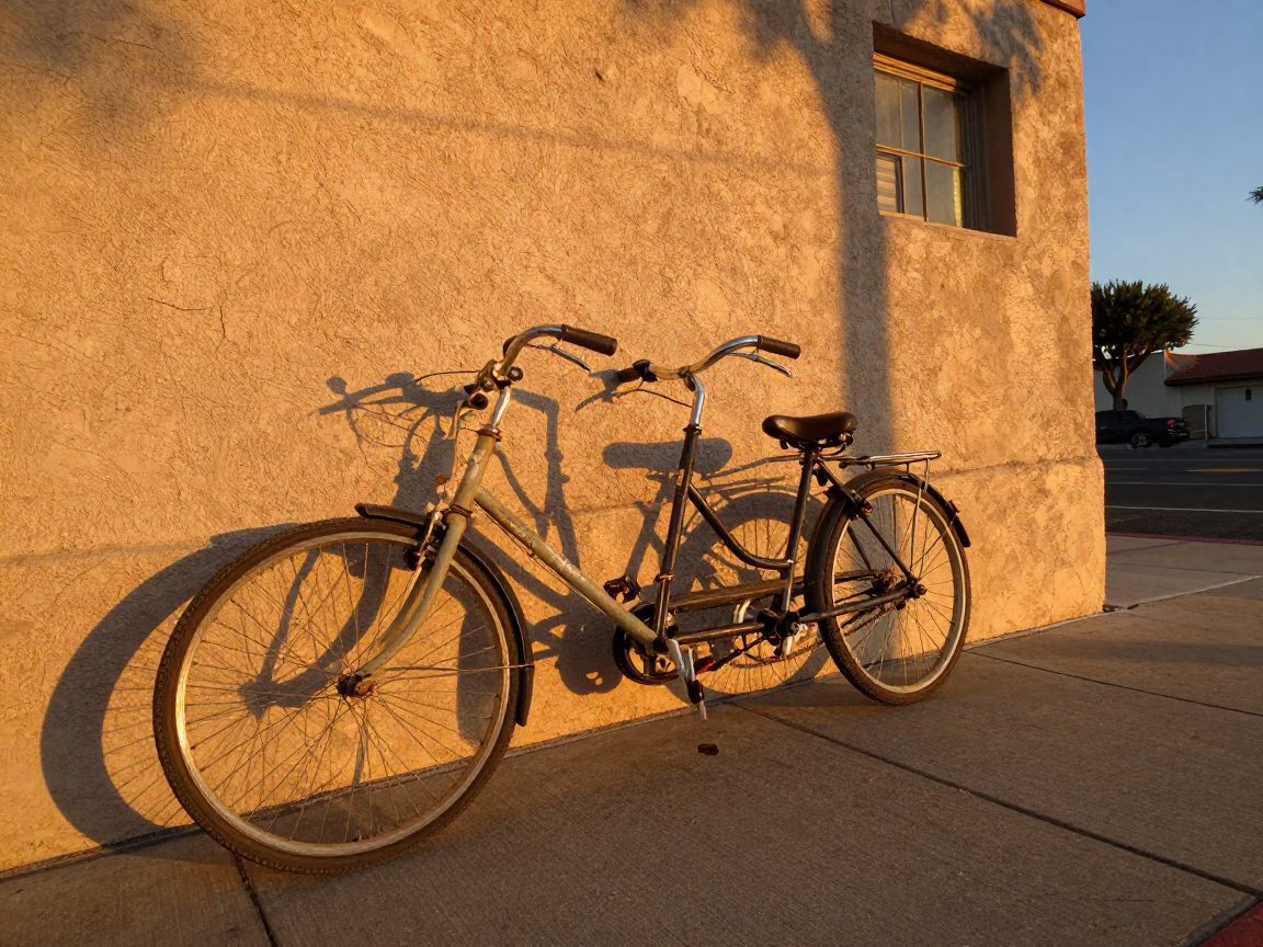 Vintage Bicycle Parked Against Adobe Wall at Sunset in San Diego California in in San Diego, California, United States