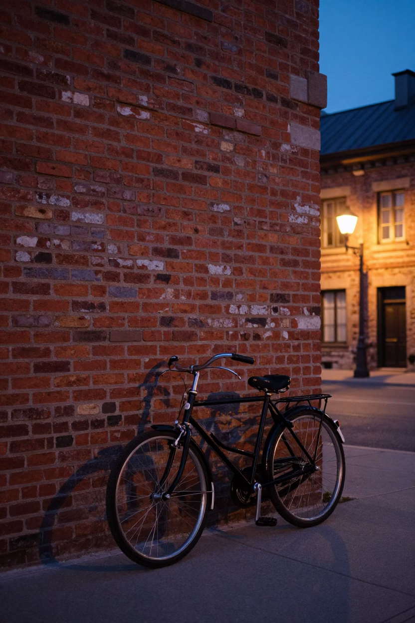 Vintage Bicycle Parked Against Brick Wall in Quebec City During Indigo Twilight in in Quebec City, Quebec, Canada