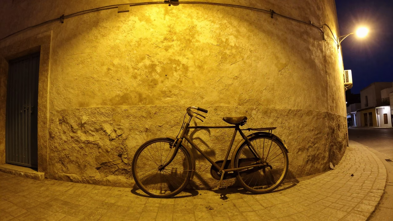 Vintage Bicycle Parked Against Stucco Wall in Tunis Tunisia Night Street Photography in in Tunis, Tunisia
