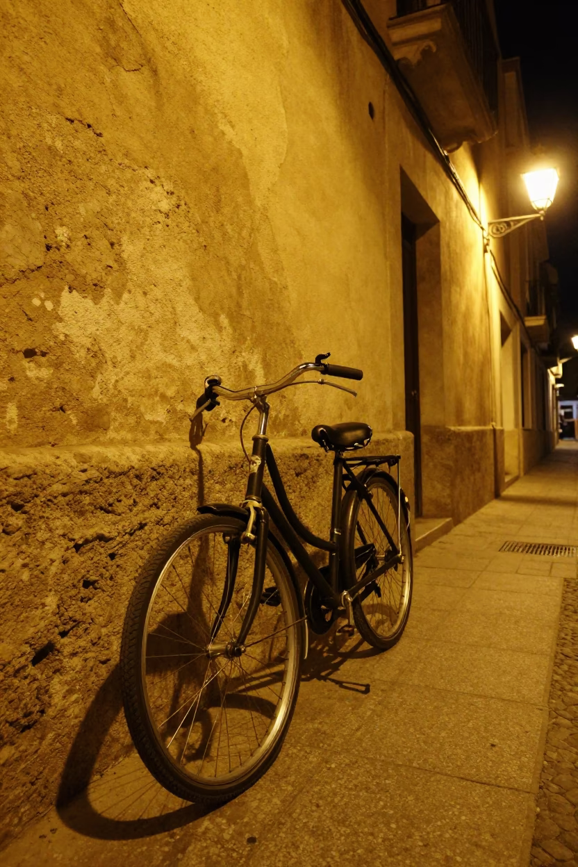 Vintage Bicycle Parked Against Wall in Valencia Spain Late Night Street Scene in in Valencia, Spain