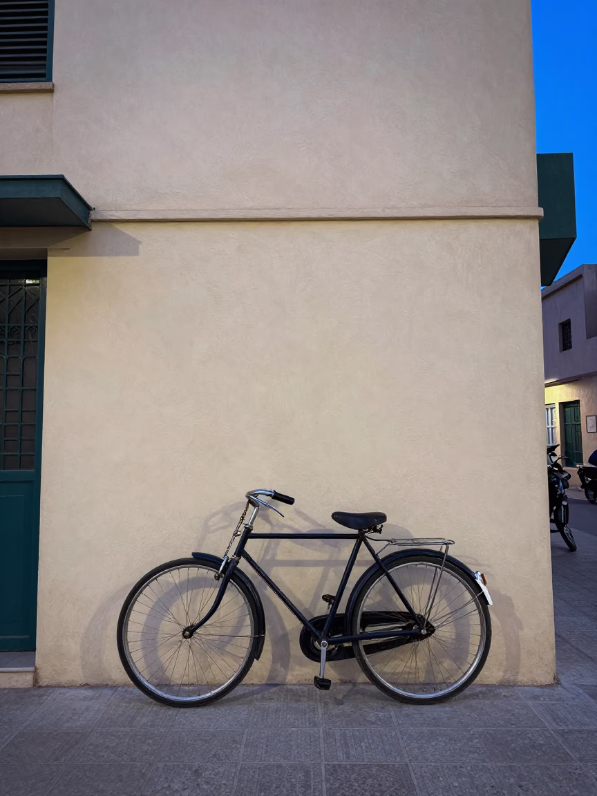 Vintage Bicycle Parked Outside Art Deco Building in Casablanca During Blue Hour Evening in in Casablanca, Morocco
