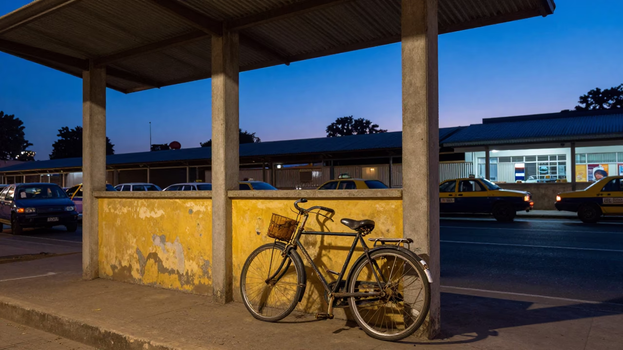 Vintage Bicycle Parked Outside Johannesburg Taxi Rank Under Indigo Twilight Streetlights in in Johannesburg, South Africa