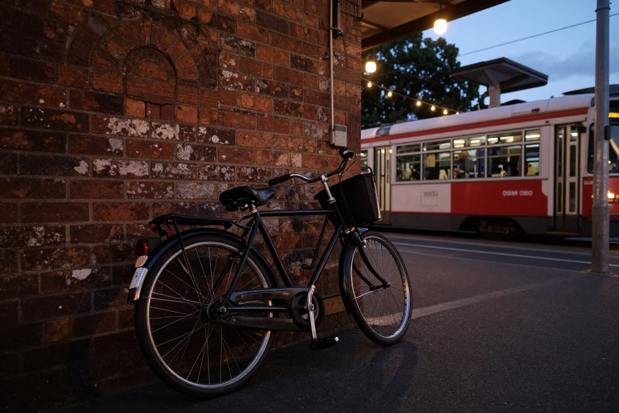 Vintage Bicycle Parked Outside Melbourne Tram Depot in Predawn Darkness with String Lights in in Melbourne, Victoria, Australia