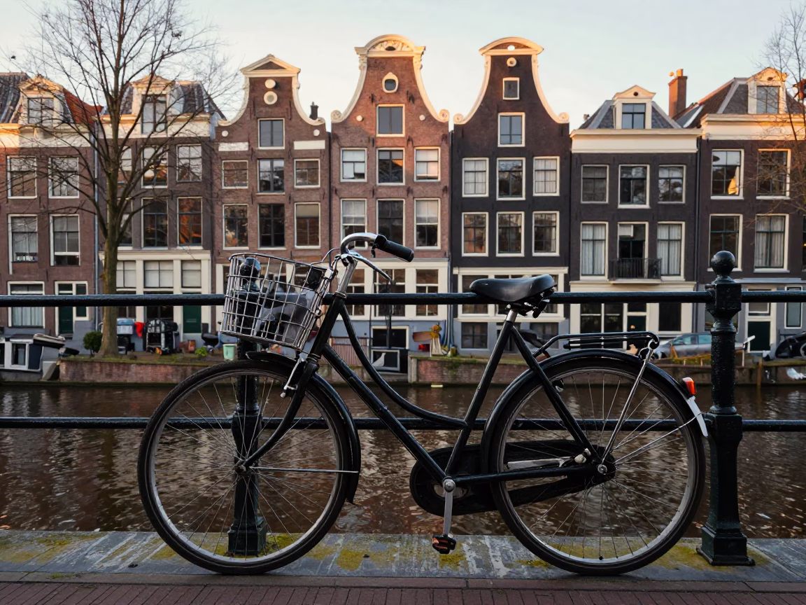 Vintage Bicycle Parked Outside Traditional Amsterdam Canal House Early Morning Street Scene in in Amsterdam, Netherlands