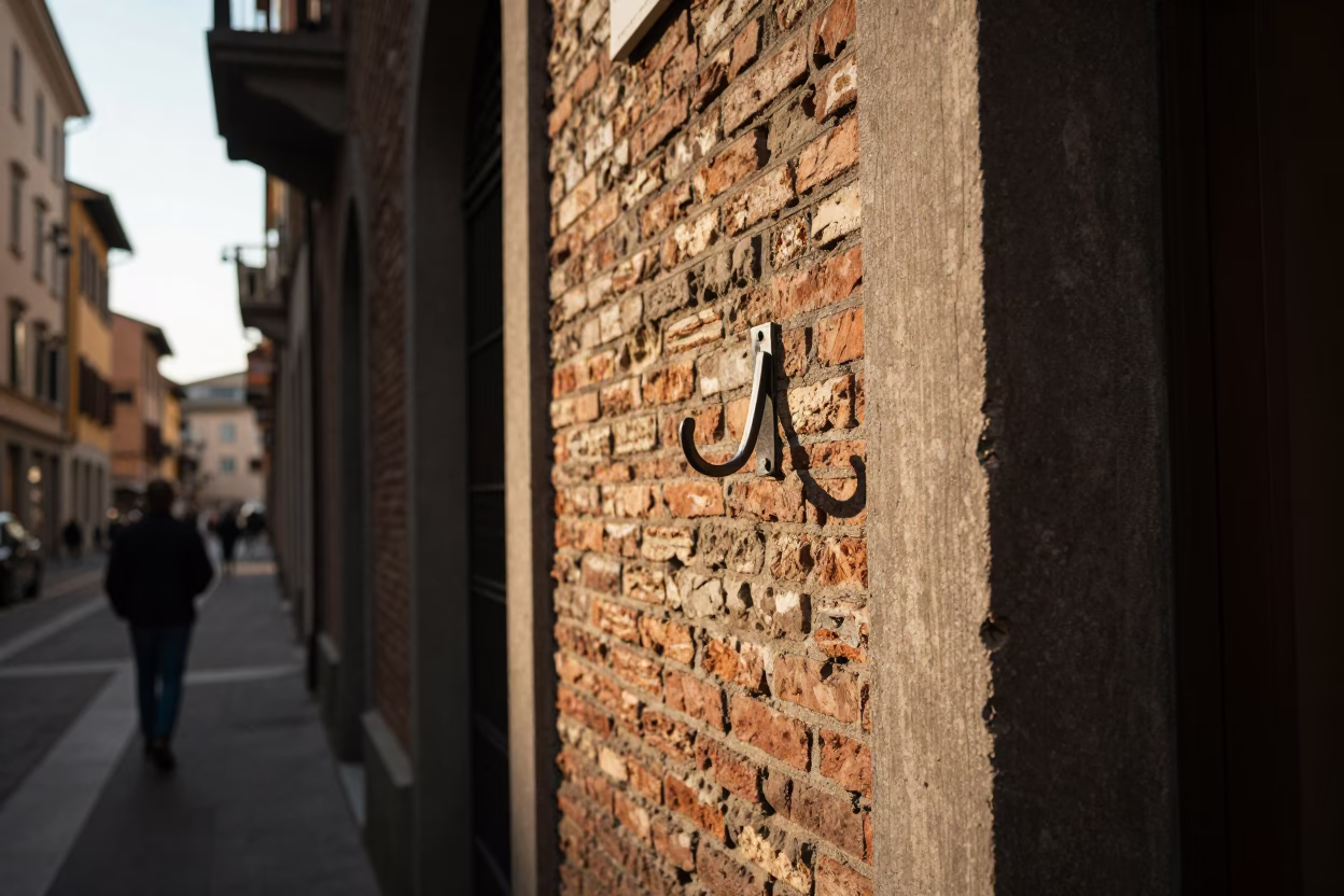 Vintage Milanese Street Scene Late Afternoon Light with Wall Hook and Wrench in in Milan, Italy