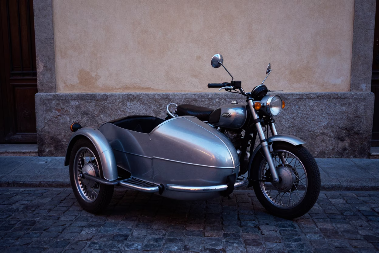 Vintage Motorcycle With Sidecar Parked On Cobblestone Street In Madrid Spain At Twilight in in Madrid, Spain