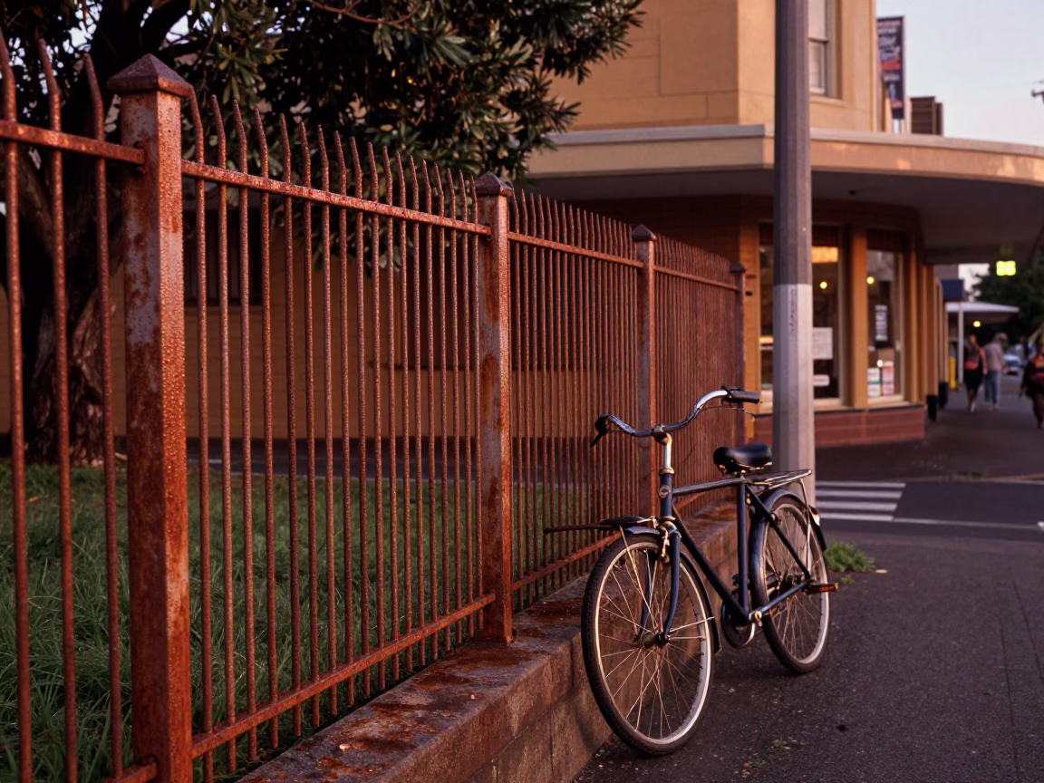 Vintage Sydney Street Scene with Substation Fence and Morning Dew in Copper Light in in Sydney, New South Wales, Australia
