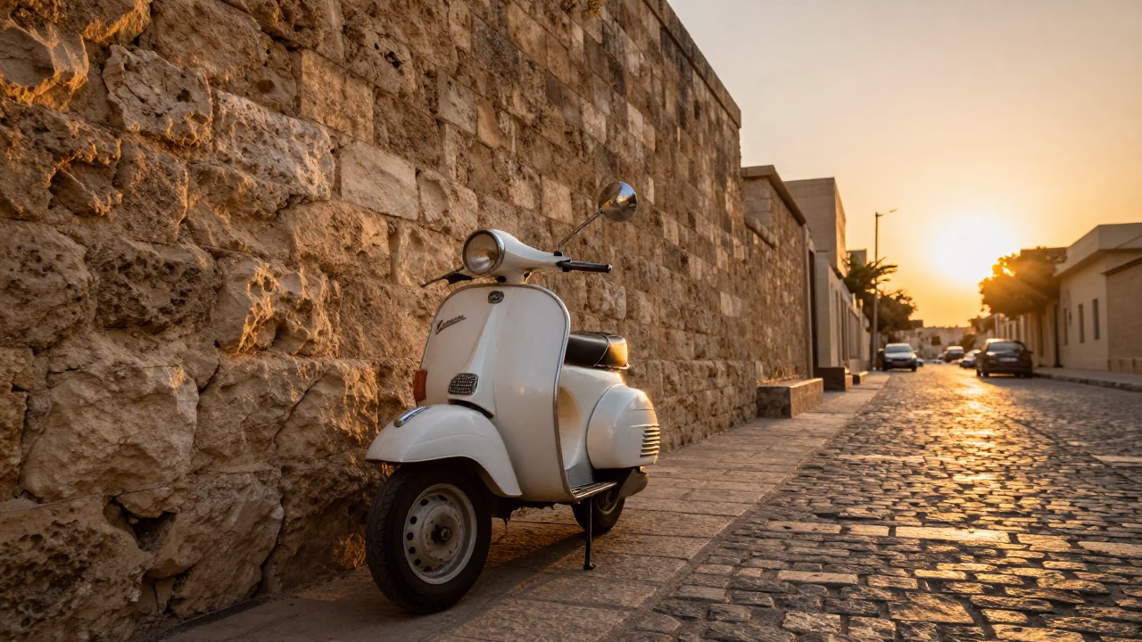 Vintage Vespa on Cobblestone Lane in Alexandria Egypt at Sunset with Geraniums in in Alexandria, Egypt