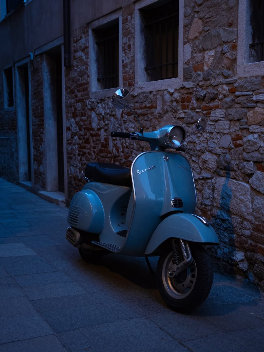 Vintage Vespa on Cobblestone Lane in Venice at Blue Hour After Sunset in in Venice, Italy