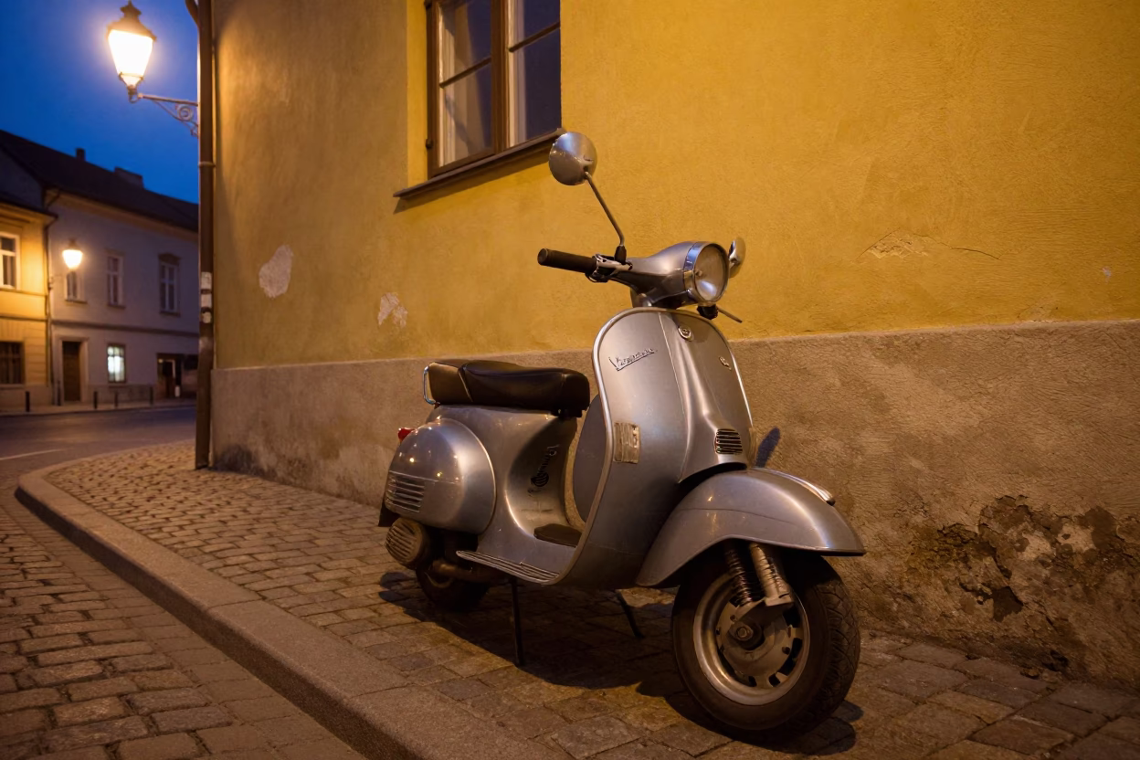 Vintage Vespa parked on Budapest cobblestone street at twilight with fruit basket in in Budapest, Hungary