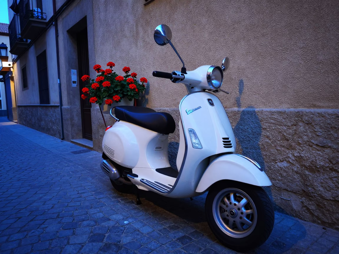 Vintage Vespa Parked on Cobblestone Lane in Barcelona at Blue Hour with Geraniums in in Barcelona, Spain