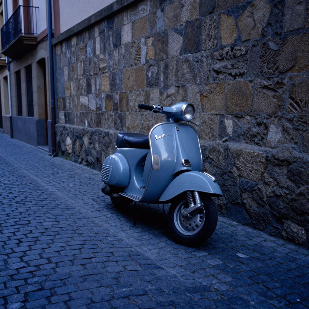 Vintage Vespa Parked on Cobblestone Lane in Bilbao Spain at Nautical Dawn in in Bilbao, Spain