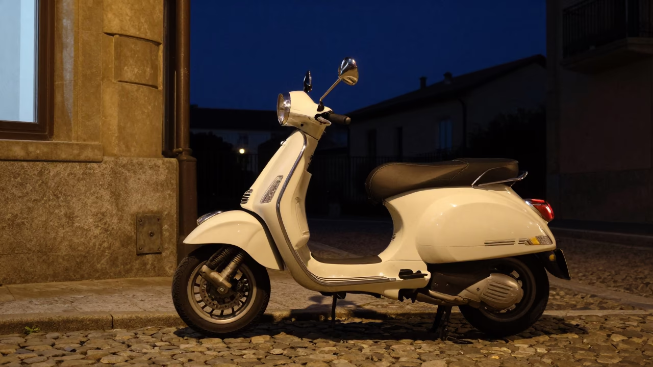 Vintage Vespa Parked on Cobblestone Lane in Bilbao Spain Under Deep Night Sky in in Bilbao, Spain