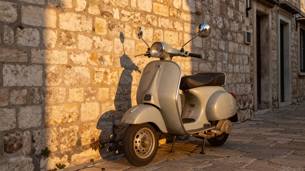 Vintage Vespa Parked on Cobblestone Lane in Dubrovnik Croatia During Honeyed Evening Light in in Dubrovnik, Croatia