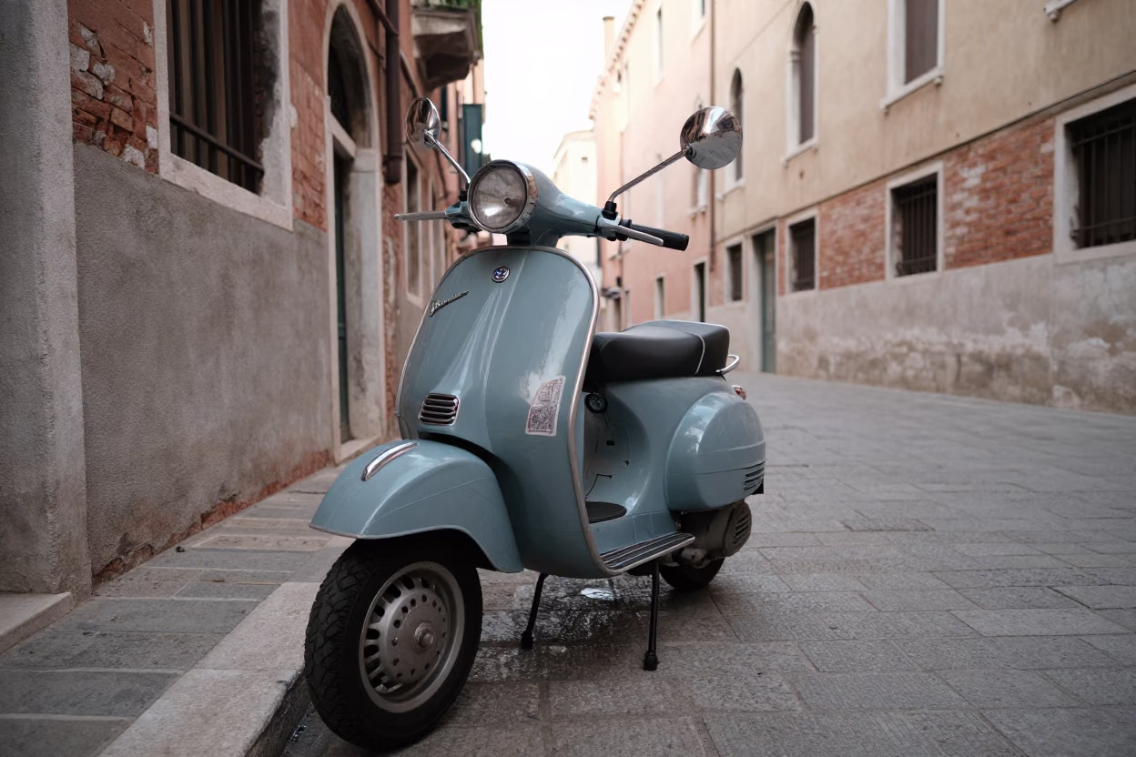 Vintage Vespa Parked on Cobblestone Lane in Early Morning Venice Italy in in Venice, Italy