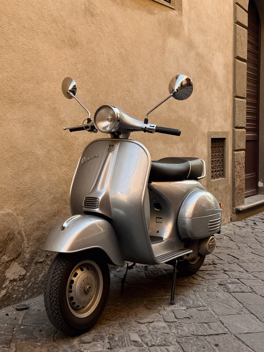 Vintage Vespa parked on cobblestone lane in Florence Italy under clear late-afternoon light in in Florence, Italy