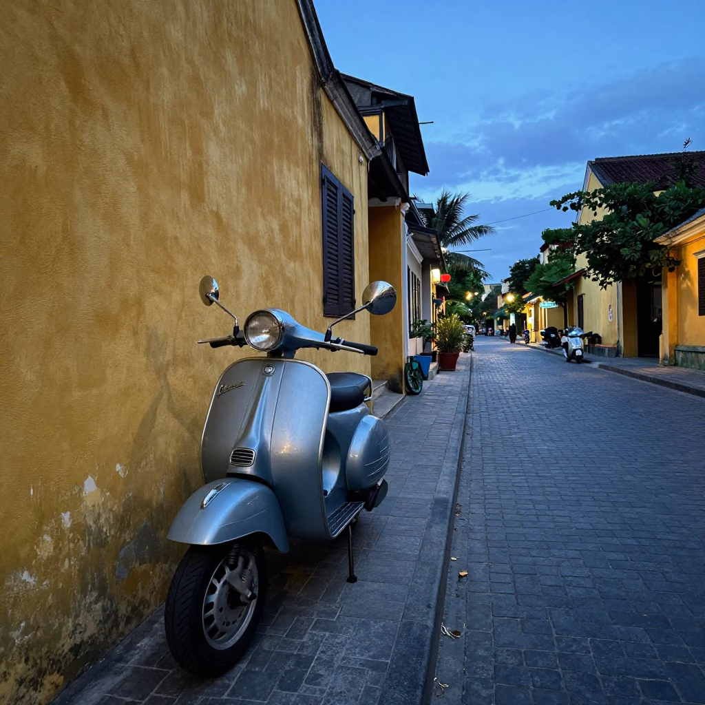 Vintage Vespa Parked on Cobblestone Lane in Hoi An Vietnam at Nautical Dawn in in Hoi An, Vietnam