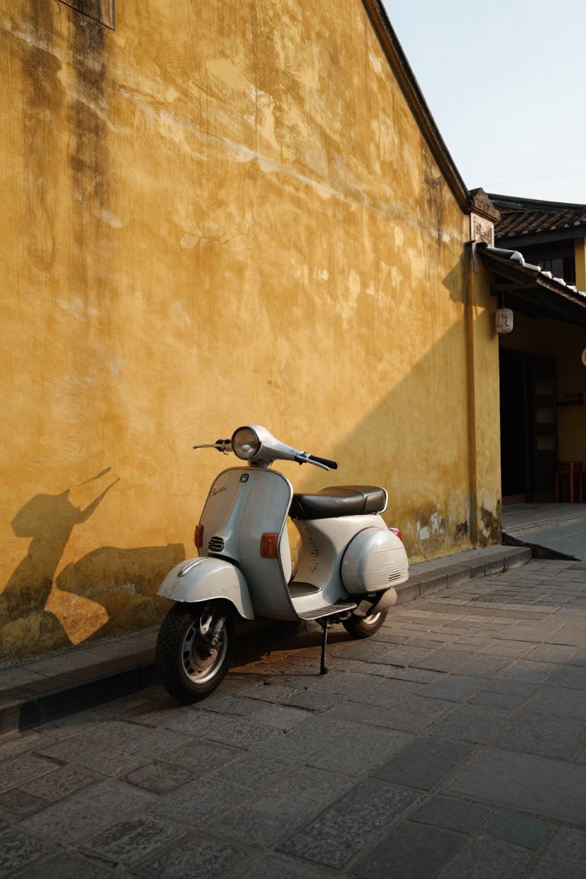 Vintage Vespa Parked on Cobblestone Lane in Hoi An Vietnam Late Afternoon in in Hoi An, Vietnam