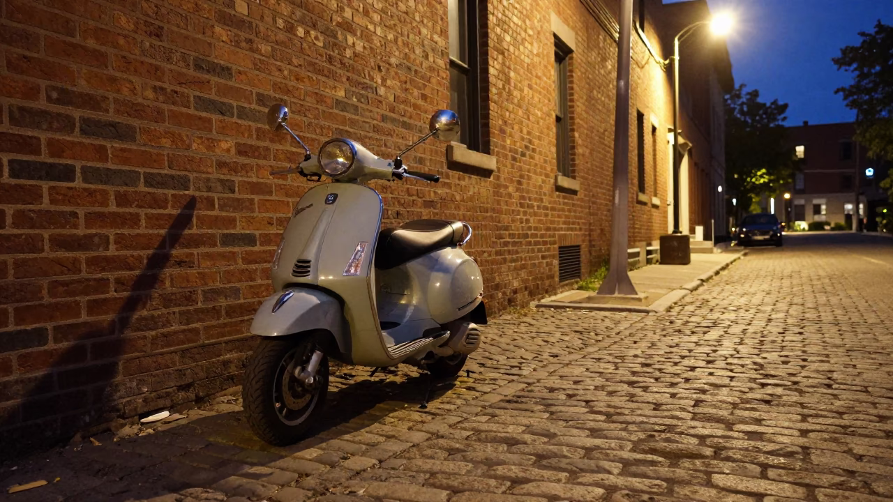 Vintage Vespa Parked on Cobblestone Lane in Late Night Toronto Ontario Canada in in Toronto, Ontario, Canada