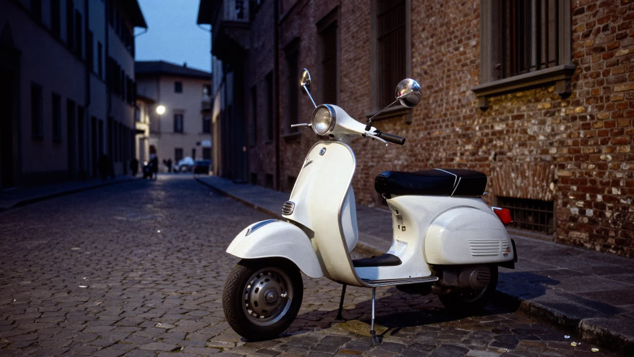 Vintage Vespa Parked on Cobblestone Lane in Milan Italy at Blue Hour After Sunset in in Milan, Italy