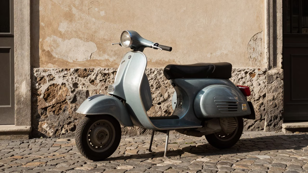 Vintage Vespa parked on cobblestone lane in Milan Italy early afternoon street scene in in Milan, Italy