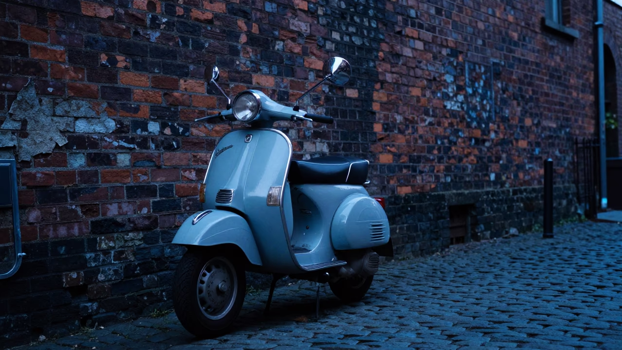 Vintage Vespa Parked on Cobblestone Lane in Portland Oregon Before Dawn in in Portland, Oregon, United States