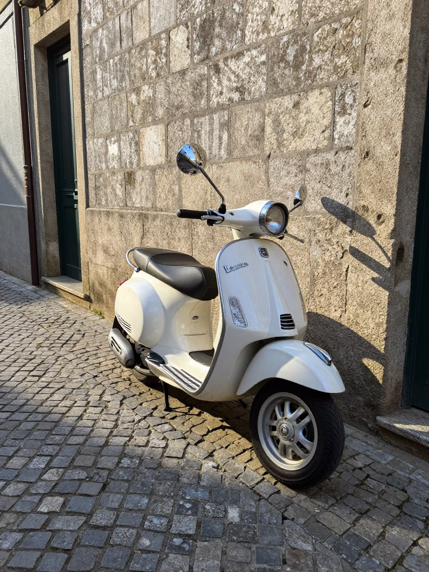 Vintage Vespa Parked on Cobblestone Lane in Porto Portugal Late Morning in in Porto, Portugal