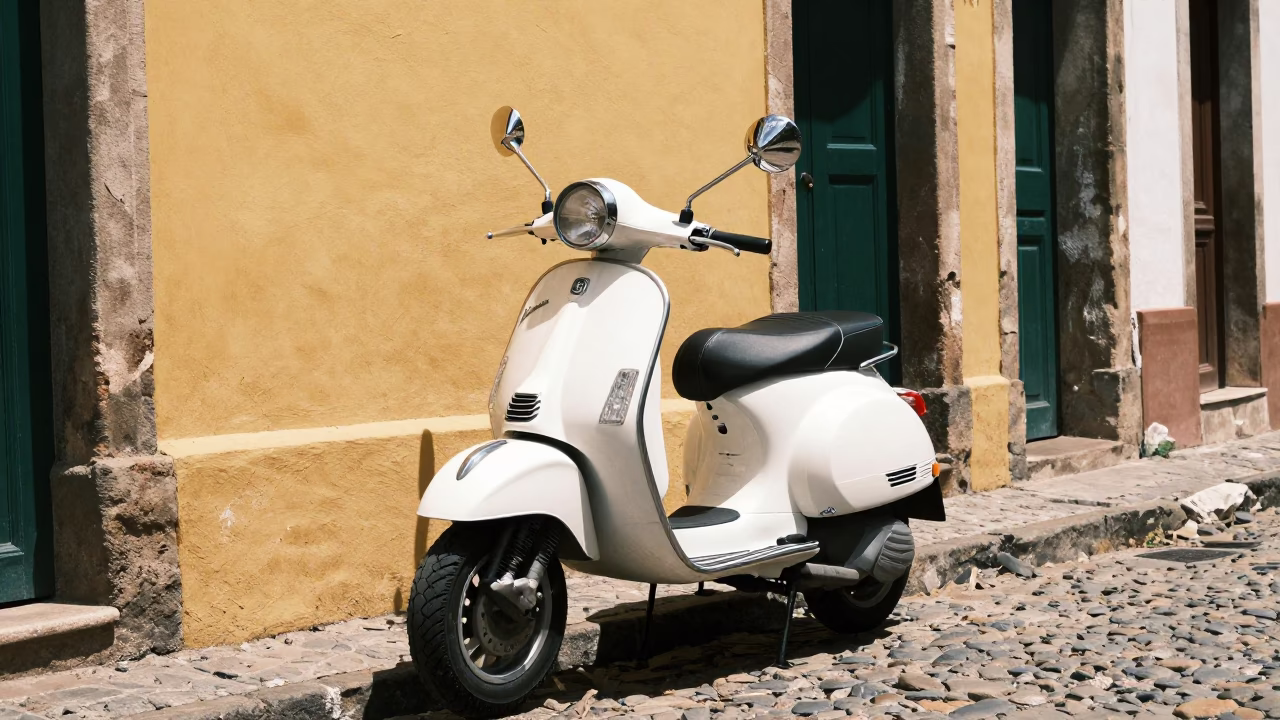 Vintage Vespa parked on cobblestone lane in Salvador Brazil midday street scene in in Salvador, Brazil