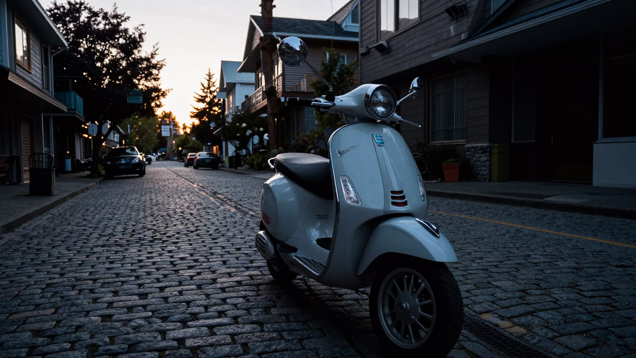 Vintage Vespa Parked on Cobblestone Lane in Vancouver Before Sunrise in in Vancouver, British Columbia, Canada