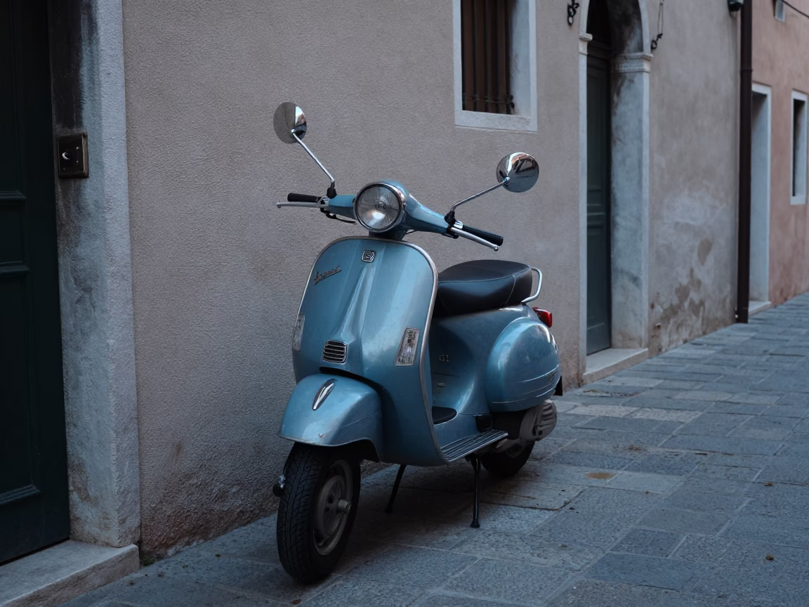 Vintage Vespa Parked On Narrow Cobblestone Lane In Pre-Dawn Venice Italy Before Sunrise in in Venice, Italy