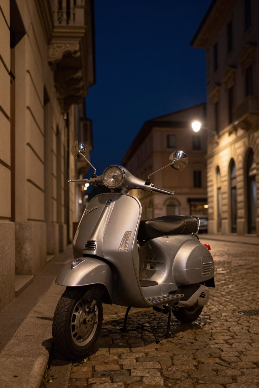 Vintage Vespa Parked Under Deep Night Sky on Milan Cobblestone Lane in in Milan, Italy