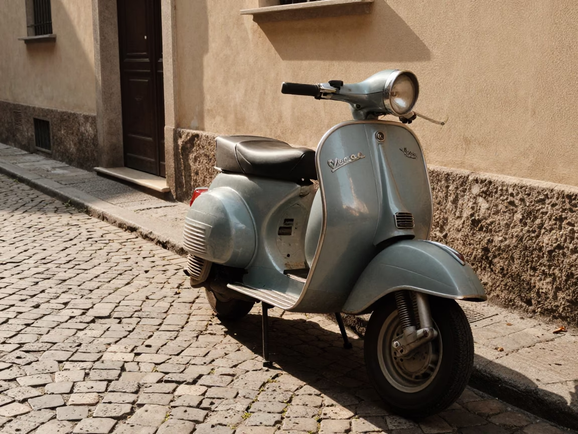 Vintage Vespa Scooter Parked on Cobblestone Lane in Late Afternoon Milan Italy in in Milan, Italy