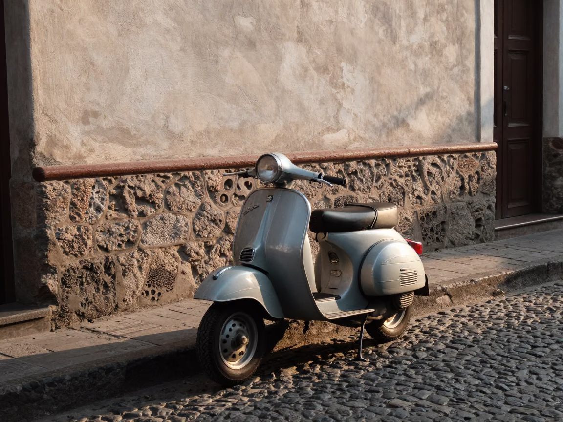 Vintage Vespa Scooter Parked on Cobblestone Lane in Medellin Colombia at First Light in in Medellin, Colombia