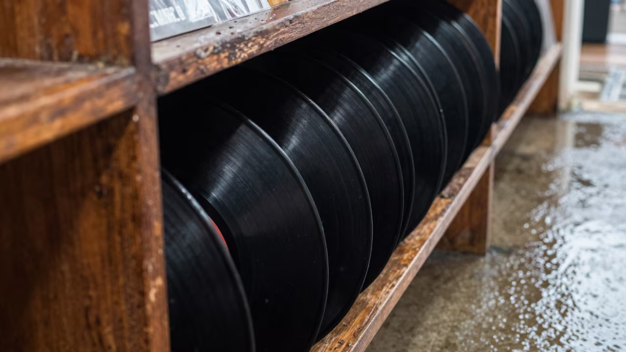 Vinyl Records Stack on Railing in Rainy Season in on a pier railing near La Popa, Cartagena