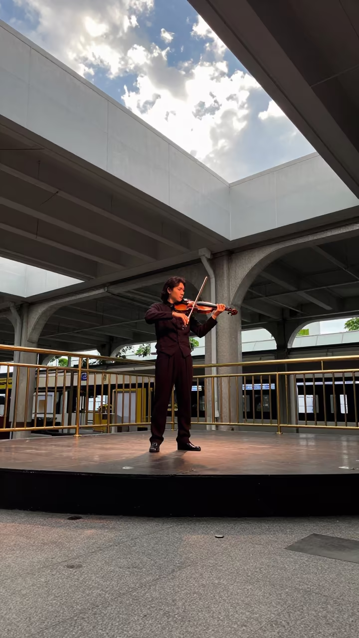 Violinist Solo Performance Taipei Station Late Afternoon in on a dimly lit stage in Taipei
