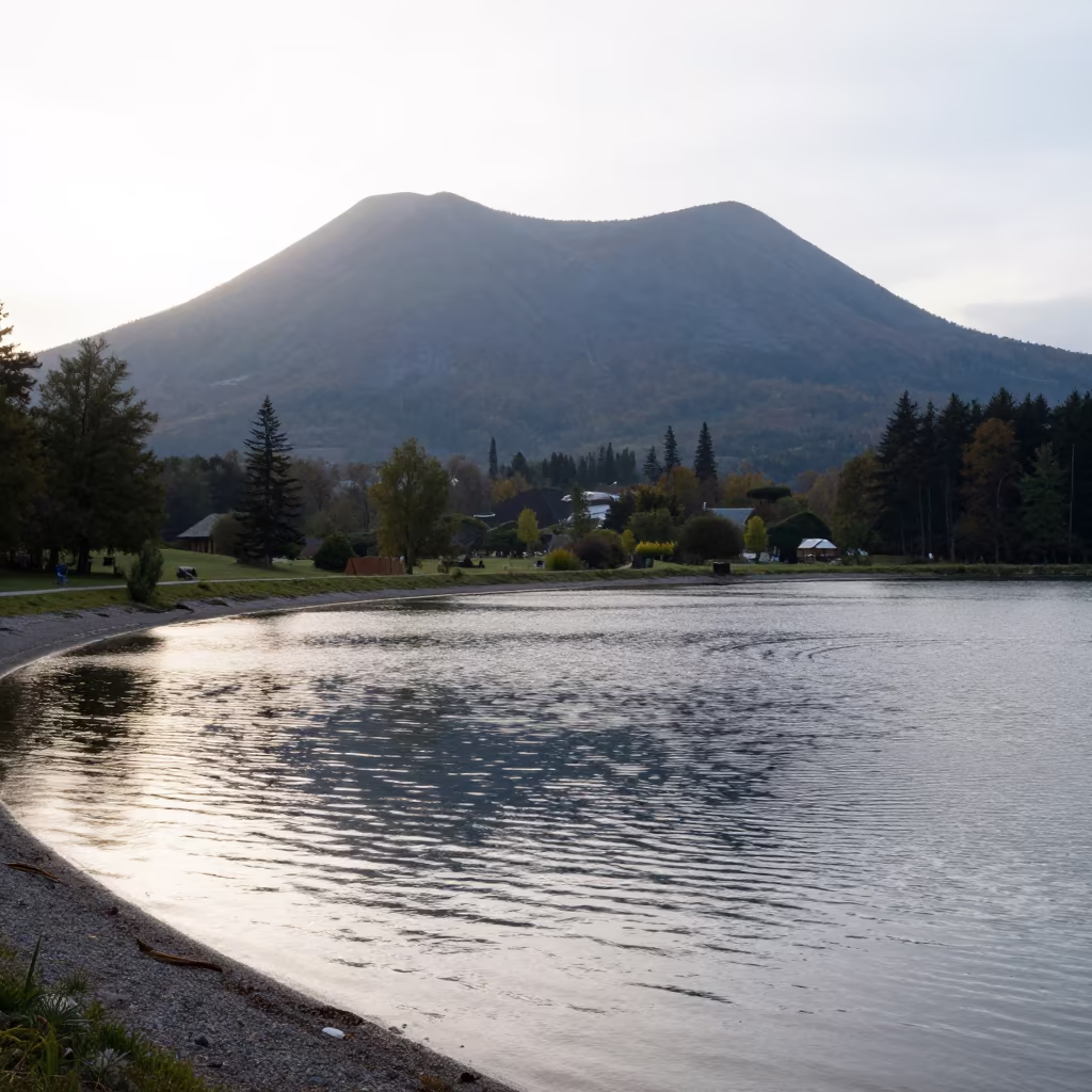 Volcanic Cone Reflection in Crater Lake Austria in along a wave-cut shoreline in Austria