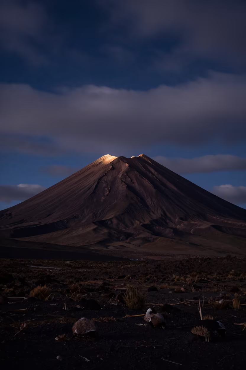 Volcanic Cone Rim Light Night Bolivia in across a wide valley floor in Bolivia