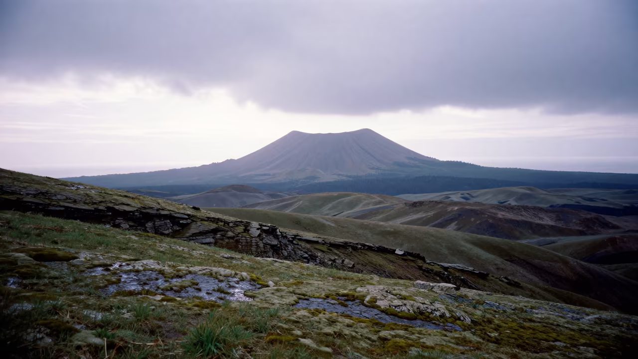 Volcanic Island Silhouette After Rain in from a ridge above layered foothills near Almaty