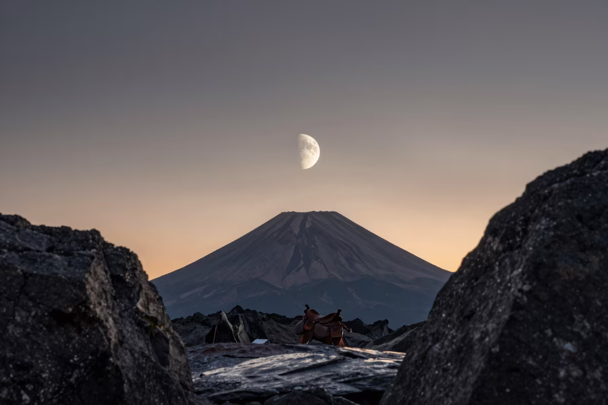 Waning Moon Over Sleeping Volcano at Sunset in from a quiet alpine saddle in Russia