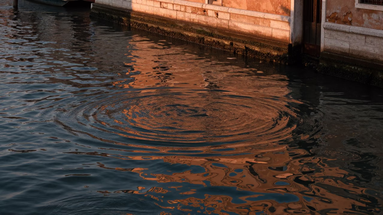 Water Ripples in Venice at Copper-toned Light Before Dusk in in Venice, Italy