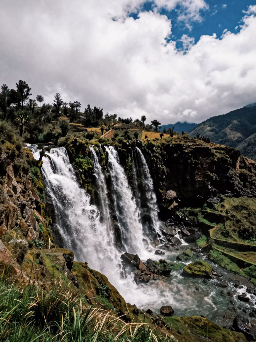 Waterfall Over Mossy Terraces Peru Ridge in from a ridge above layered foothills in Peru