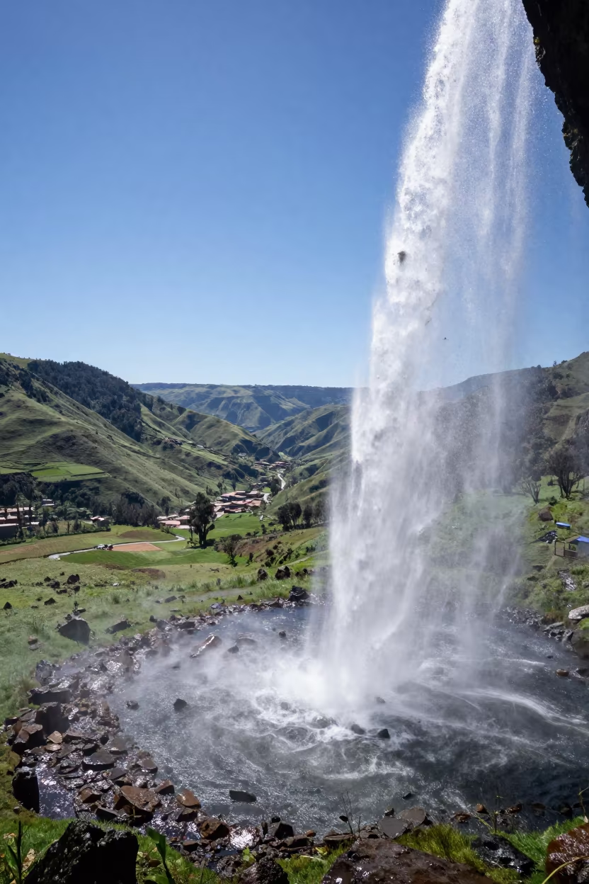 Waterfall View from Behind Curtain in Quito Valley in across a wide valley floor near Quito