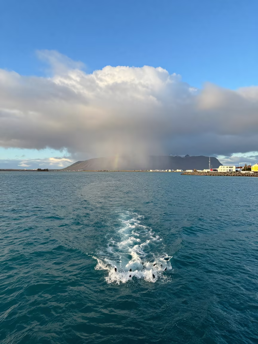 Waterspout Over Turquoise Sea Midday in over a horizon of stacked thunderheads near Old Harbour, Reykjavik