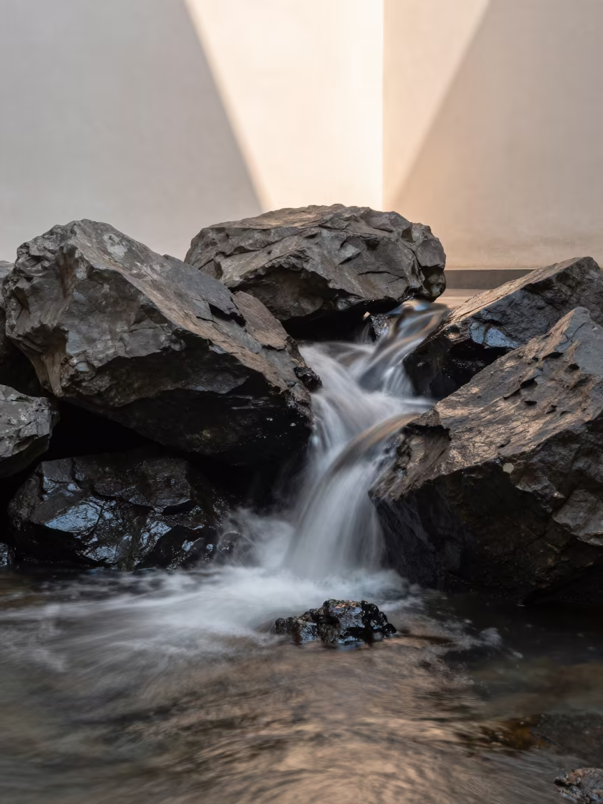 Wave Trails on Dark Rocks in Tauranga Atrium in inside a vaulted atrium in Tauranga