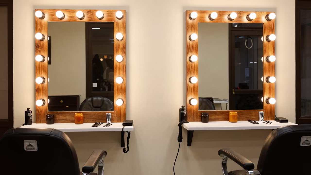 Wax Warmer Station in Nicosia Barber Shop in at a barber station beneath mirror bulbs in Nicosia