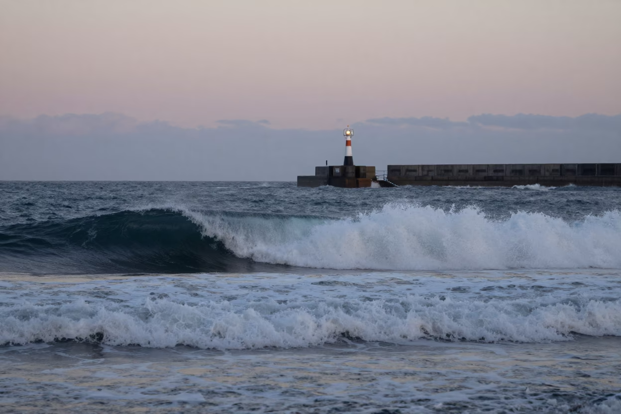 Wellington Surf Breaking at The Still Hours Before Dawn Light in in Wellington, New Zealand