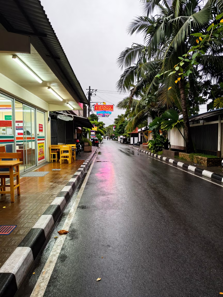 Wet Alley Pavement Reflecting Neon in Hpa-An in outside a fluorescent convenience store in Hpa-An